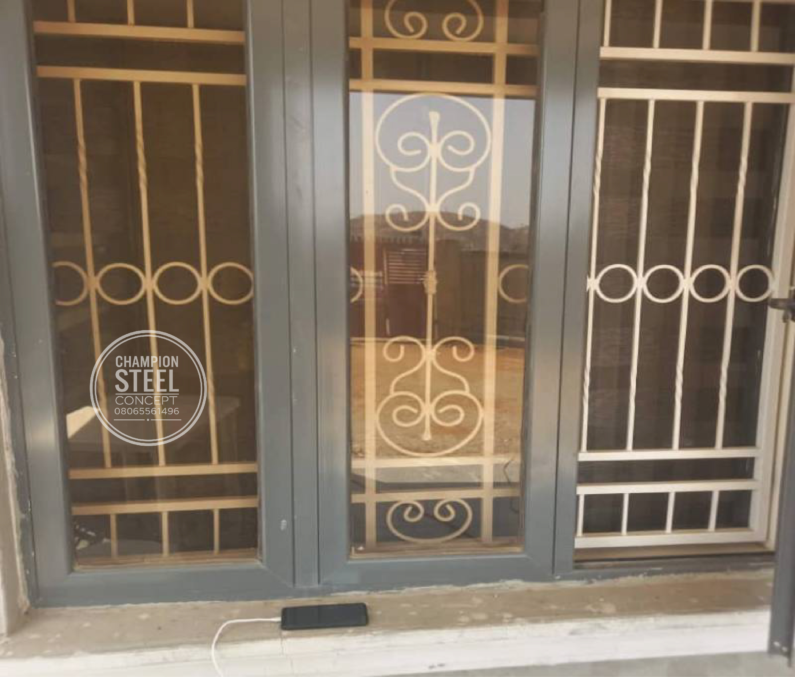 Elegant Black Ornate Window Protectors with Decorative Scrolls