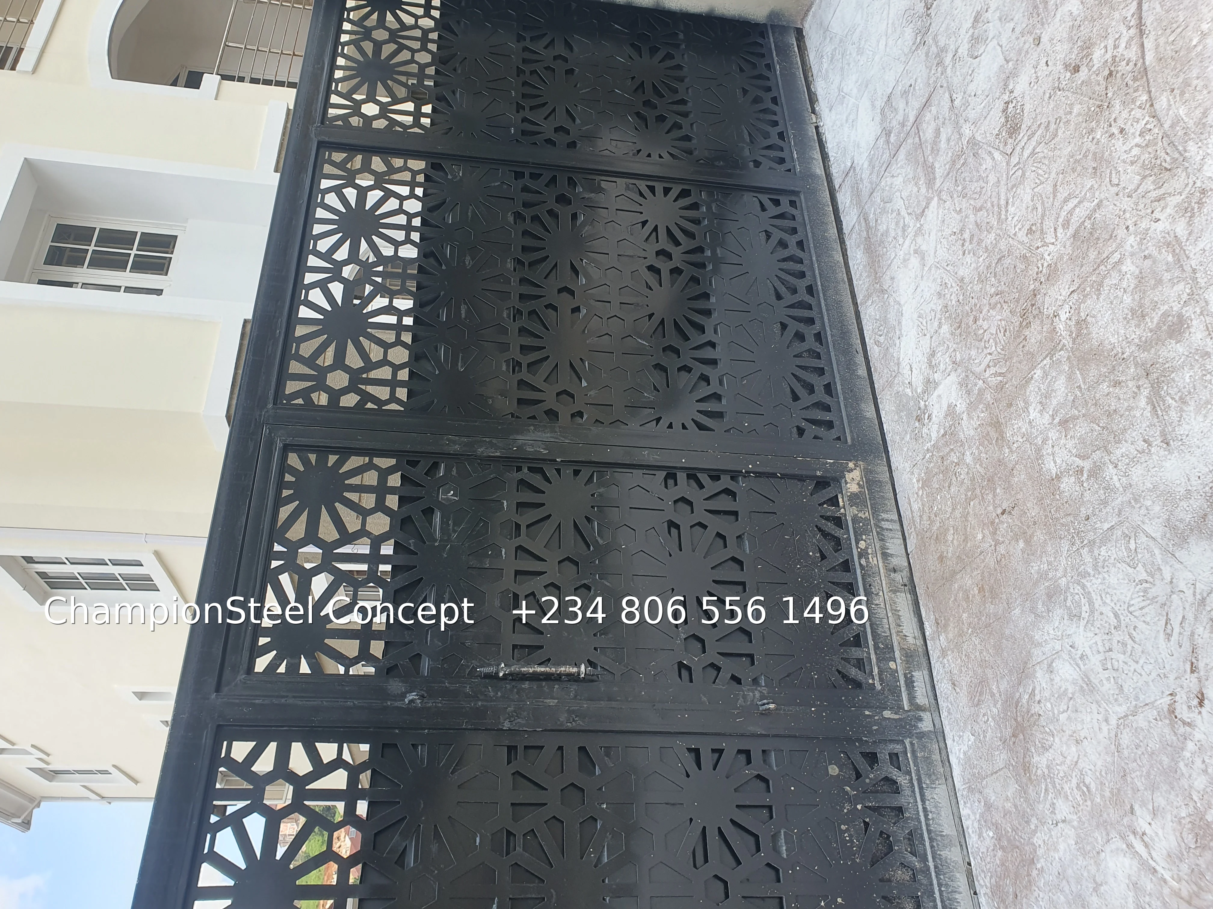 Modern Black Geometric Starburst Steel Perimeter Gate – Contemporary Privacy & Security Solution
