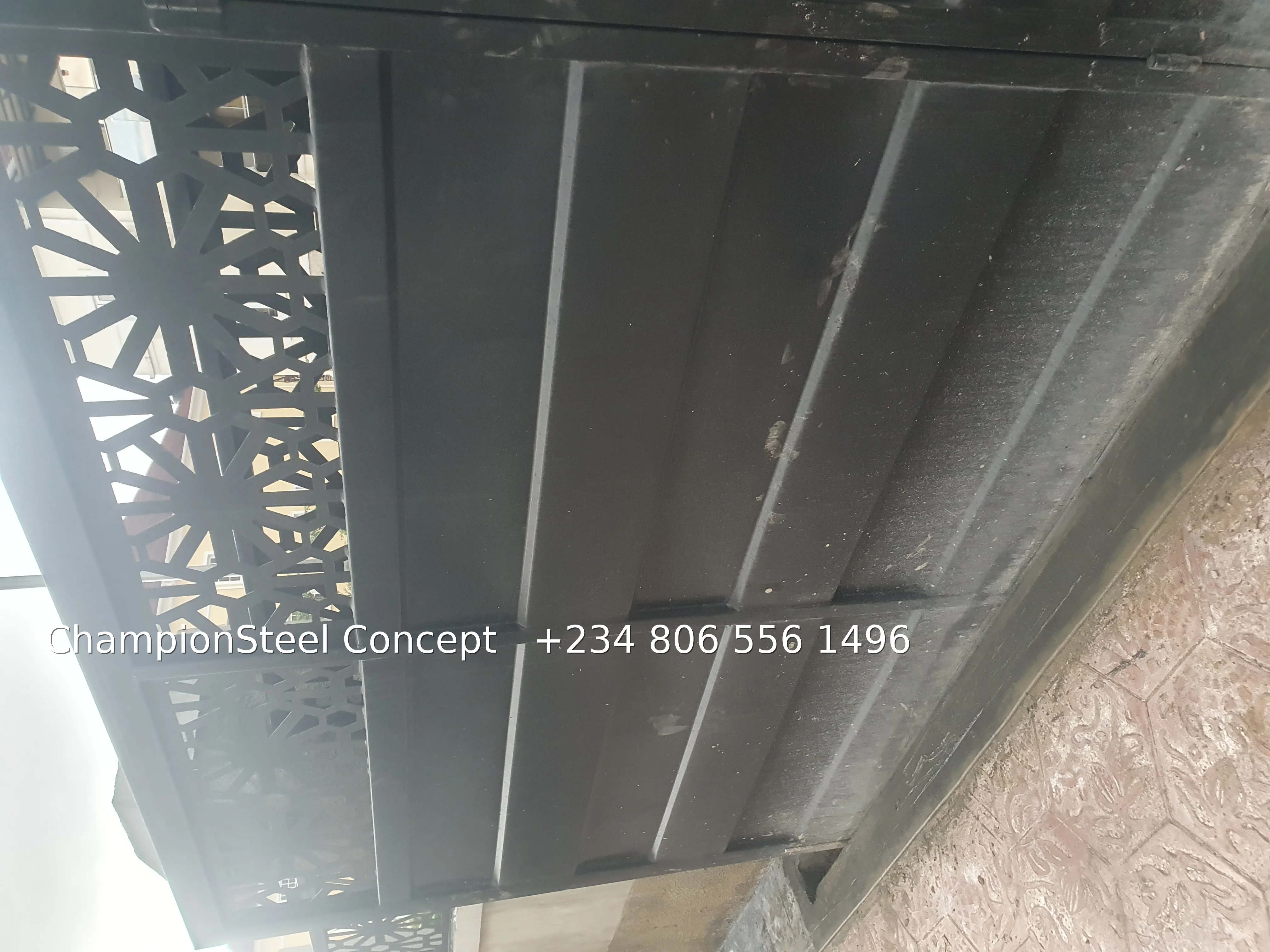 Modern Black Steel Gate with Geometric Starburst Cut-Outs – Sleek Contemporary Security Gate
